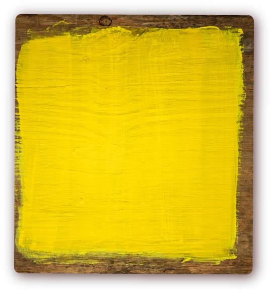 Decorative piece of wood with yellow paint
