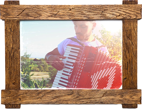 A framed photo of a musician playing an accordion