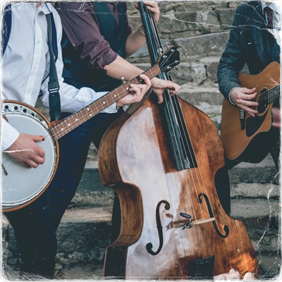 A framed photo of a band playing on a street